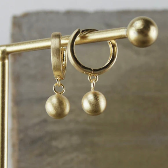 DANSK - Ball huggie earring in gold plate